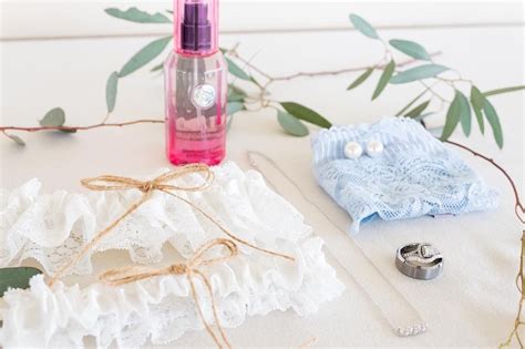 When styling your flat lay photograph, make sure to have a focal point grouped in 3 (or another odd number). Wedding flat lay, wedding details, bride, something old something new, something borrowed ...