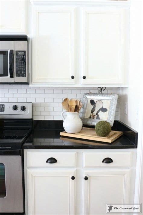 After 12 hours, polish off any remaining grout. How to Easily Change the Color of Existing Grout | Black granite countertops, Backsplash black ...