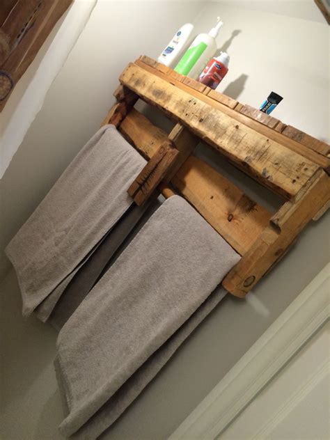 Towel Rack Made From An Old Wooden Pallet Bed Frame And Dowels