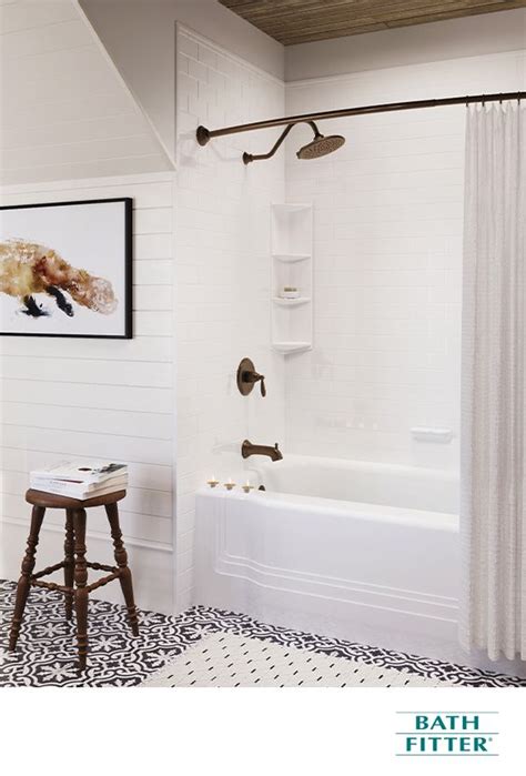 A Bathroom With White Walls And Black And White Flooring An Old