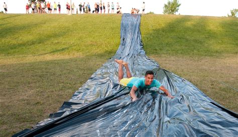 (we bought a great one here, if you need your slip n' slide to be longer, buy another one and cut off your desired length and tape awesome job!! Giant Slip n Slide (YEG) - November Project