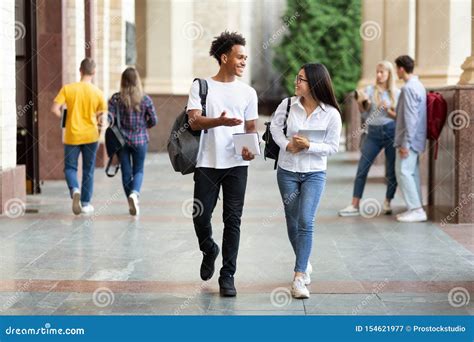Happy Diverse Students Walking In College Campus Stock Image Image Of