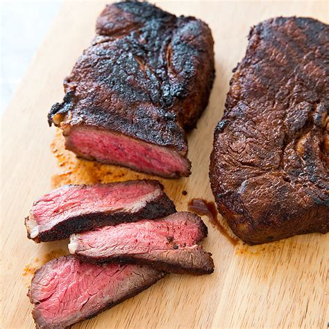 Chuck roast becomes as moist, tender, and flavorful as traditional texas brisket in this recipe that smokes and then slices the roast. mock tender roast grill