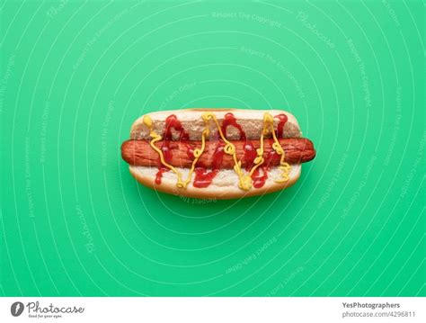 Hot Dog Top View Minimalist On A Green Background A Royalty Free