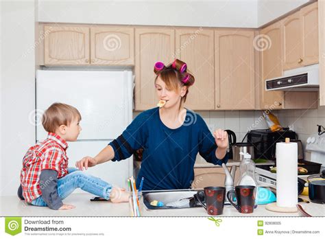 Busy White Caucasian Young Woman Mother Housewife With Hair Curlers In