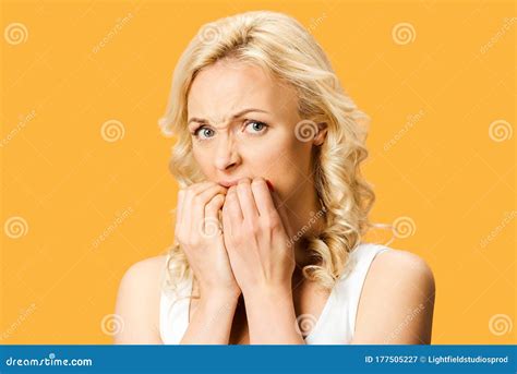 Frightened Blonde Woman Looking At Camera And Covering Mouth Stock Image Image Of Frightened