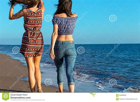 Pretty Girl Has A Fun With Her Girlfriend On The Beach Stock Image Image Of Holding Lovers