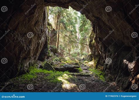 Exit To Forest From The Dark Rocky Cave Stock Photo Image Of