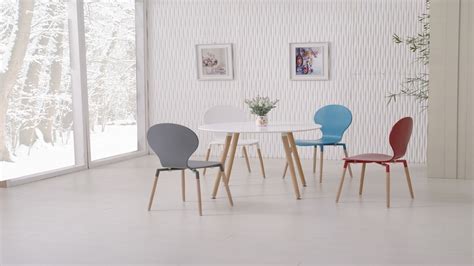Easily save space by stacking these chairs when they are not in use. Round Wooden White Dining Table and 4 Mixed Coloured Chairs