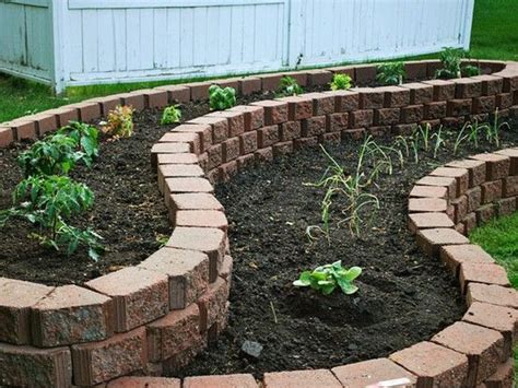 When you make a raised garden bed, the height is purely down to your and your garden's needs. Maybe put the tree in the backyard in the widest part and ...