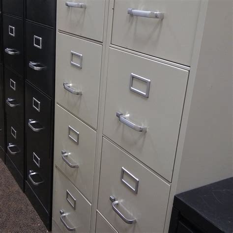 Four drawers cabinet, either metal or wood, can store up to 3000 files and other frequently used items such as bills, dvds or photos. 4-Drawer Putty Letter Sized Vertical File Cabinets-Used