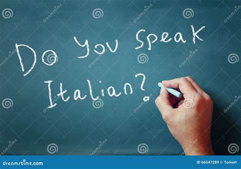 The Question Do You Speak Italian Written On Chalkboard And Male Hand