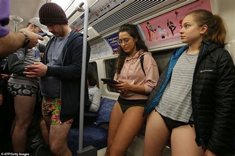 passengers riders take off trousers as part of no pants subway ride no pants day no pants