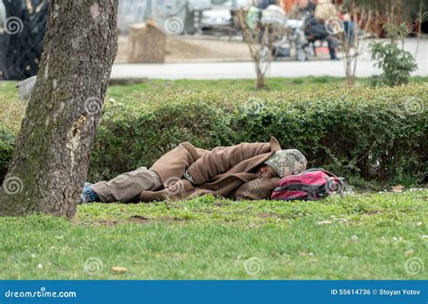 Homeless Half Naked Man Sleeping In The Park Editorial Photo