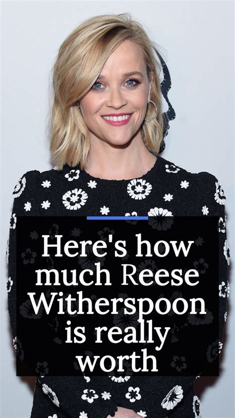 A Woman Holding A Sign That Says Heres How Much Reese Witherspoo Is Really Worth