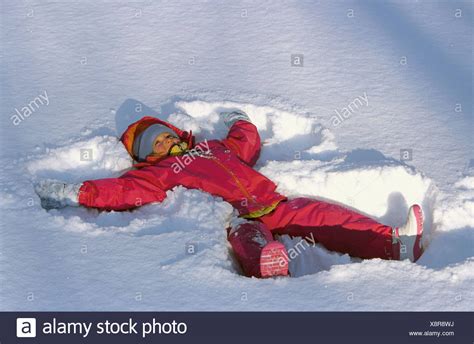 Children Making Snow Angels High Resolution Stock Photography And