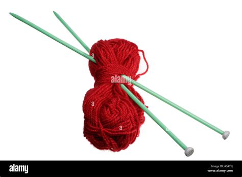 A Pair Of Knitting Needles And Red Wool Stock Photo Alamy
