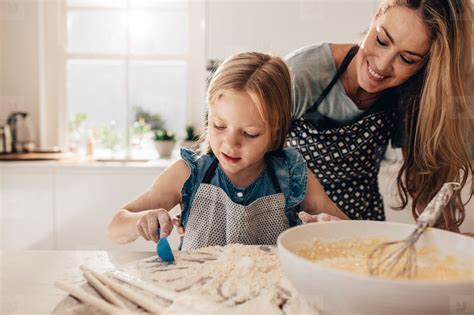Mother Teaching Her Daughter To Cook In Kitchen Stock Photo 124574