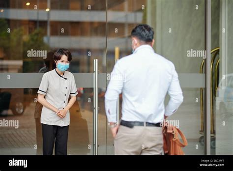 Hotel Manager Greeting Guest Stock Photo Alamy