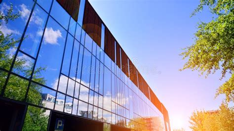 Architecture Details Modern Glass Building Facade In Sunny Day