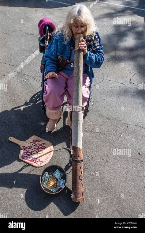 Woman Playing Didgeridoo At The Santa Barbara California Farmer S Market The Didgeridoo Also