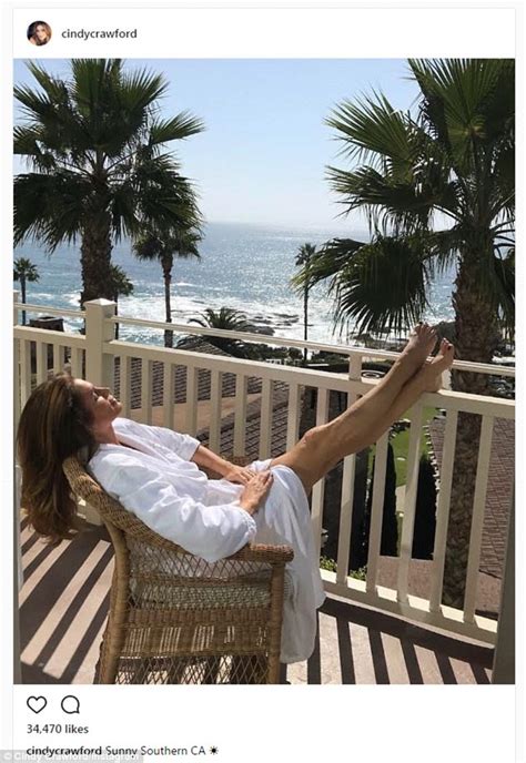 Cindy Crawford Flashes Her Toned Legs In Bathrobe Daily Mail Online