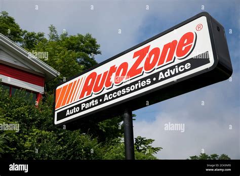 A logo sign outside of a AutoZone retail store location in Frederick