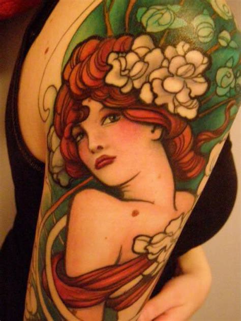A stunning Jeff Gogue Art Deco tattoo of a pin up girl with flowers in