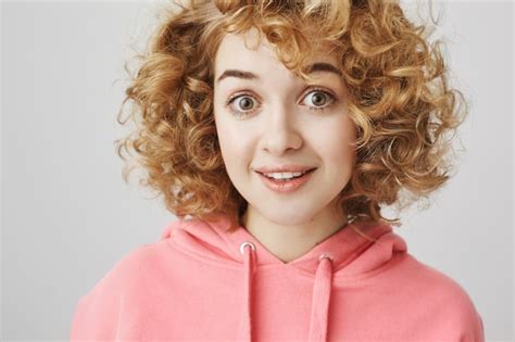 Free Photo Surprised Cute Curly Haired Girl Looking Amused