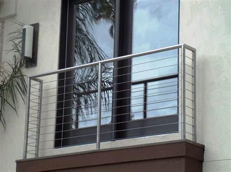 In two of the three houses we've lived in, we had in our two story house, we redid a portion of the deck and had wooden vertical deck rails that we continued to use for the rest of the project. Aluminum Balcony Railing 2
