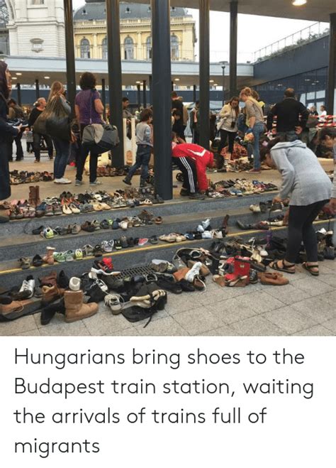 hungarians bring shoes to the budapest train station waiting the arrivals of trains full of