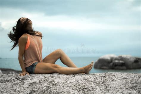 Woman Flicking Her Hair On A Rock At Sunset On Bakovern Beach Cape Town Stock Photo Image Of