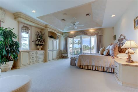 An Elegant Master Suite Is Complete With A Sitting Area And A Private