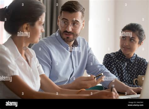 Young Smart Multiracial Business People Working In Office Stock Photo