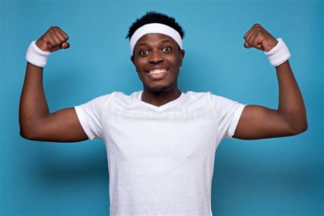 Happy Strong Man In Sport Gym Shows Muscles Glad To Be Fit And