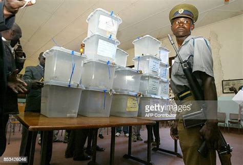 A Zimbabbwean Police Officer Stand Guard By Ballot Boxes On April 19 Photo Dactualité