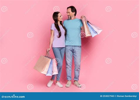 Full Body Portrait Of Two Positive Friendly People Embrace Look Each