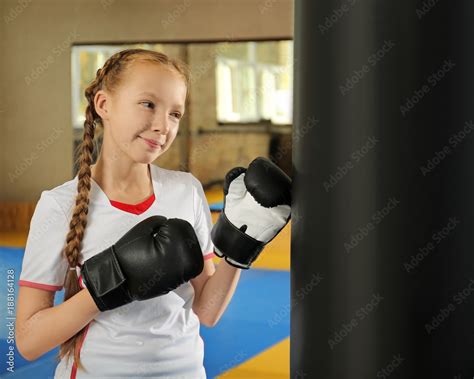 Cute Little Girl In Boxing Gloves Indoors Stock Photo Adobe Stock