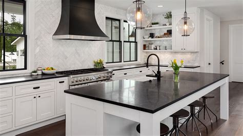 This awesome black and white kitchen is a great example of how you can make heavily contemporary styles very approachable to the average home buyer. Monochrome Kitchen Ideas: The Renov8 Edition