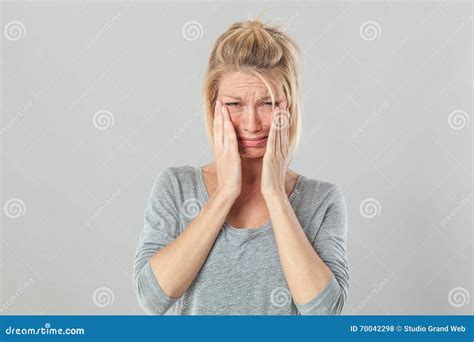 Blond Crying Teen Girl With Long Hair And Blue Eye Stock Image