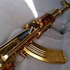 Gold Everything: Prezzo Flaunts Ring, Watch & Gold-Plated AK-47 Rifle ...