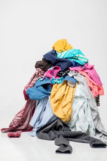 Premium Photo Pile Of Used Clothes On A Light Background Second Hand