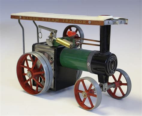 A Mamod Te1a Live Steam Traction Engine And Three Boxed Accessories