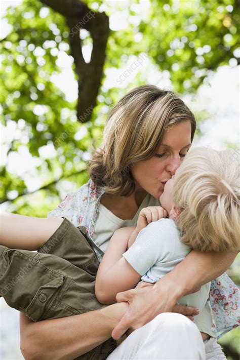mother kissing son stock image f003 7380 science photo library