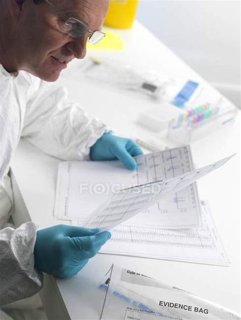 Forensic Scientist Examining Dna Sequencing Results — Spectacles