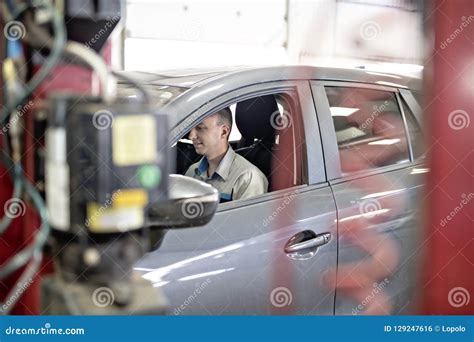 Handsome Mechanic Job In Uniform Working On Car Stock Photo Image Of
