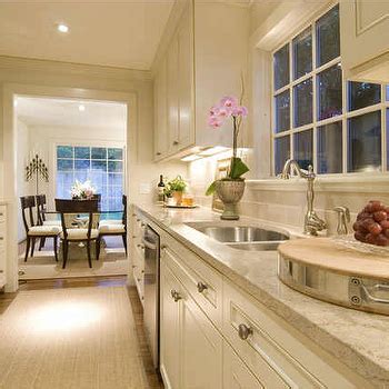 They are white kitchen cabinets (kronospan: Creamy White Kitchen Cabinets Design Ideas