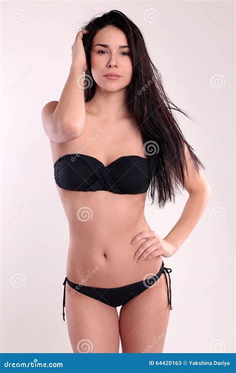 Beautiful Woman With Perfect Body With Dark Straight Hair Wears Black Bikini Stock Image