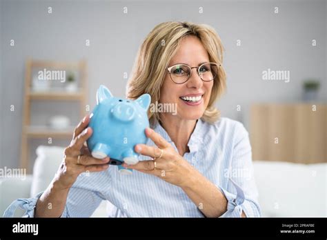 Happy Money Saving Woman Stock Photo Alamy