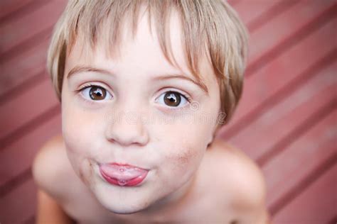 Boy With Dirty Face Sticking His Tongue Out Stock Photo Image 29484912